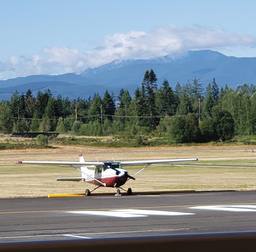 view of plane and runway from cafe