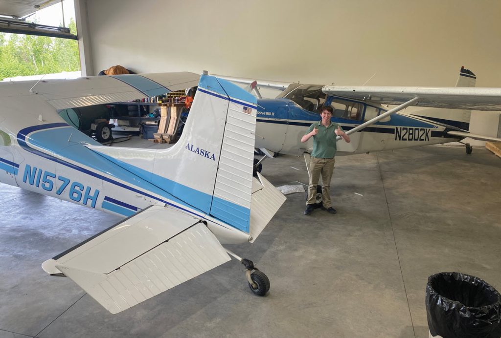 Cessna 180 and Cessna 185 in hangar