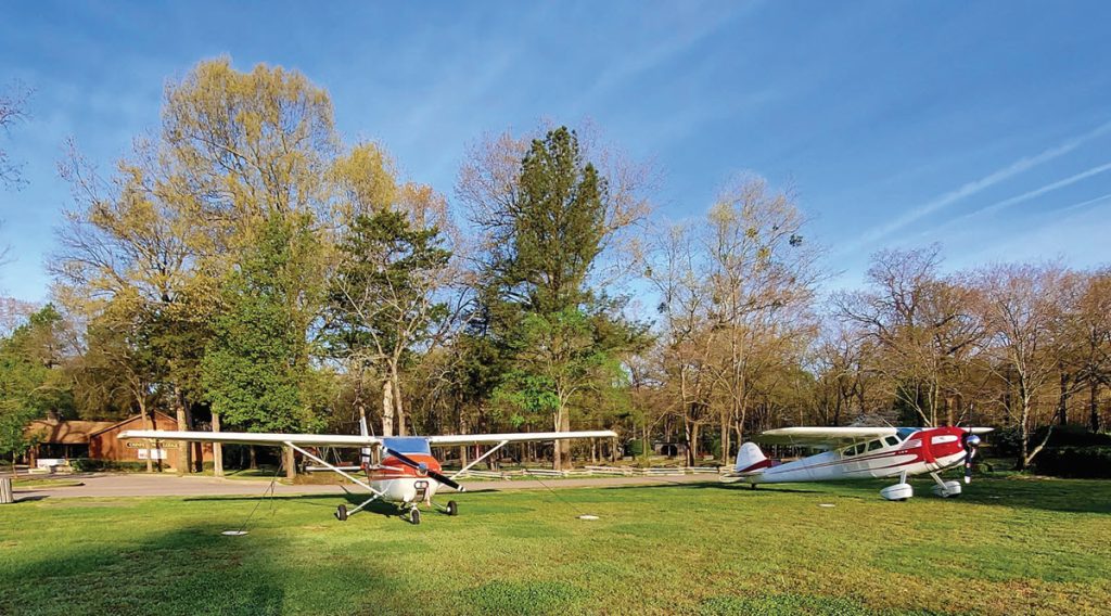 Grass landing strip with planes