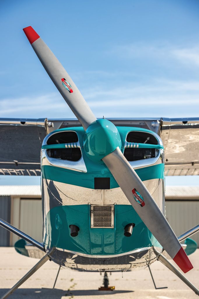 front view of silver and teal Cessna 170B
